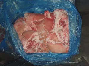 Frozen pork jowls rind on